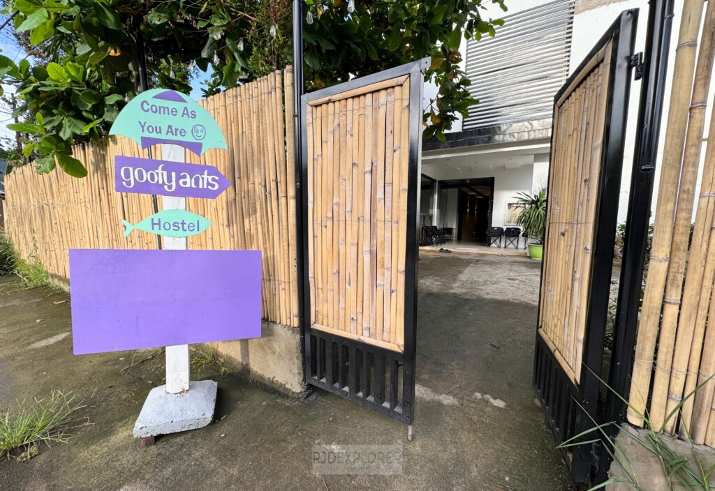 welcome sign goofy ants hostel